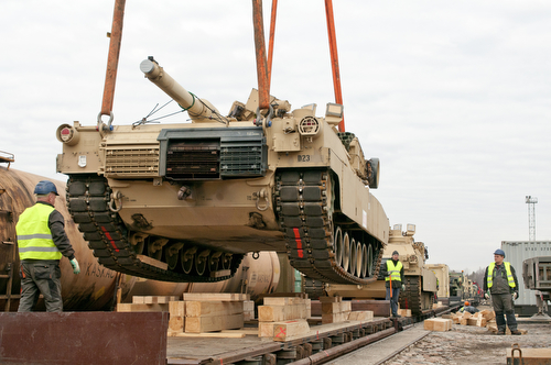 The first Abrams M1A2 tank for the 2-7 Infantry Battalion, 1st Armored Brigade Combat Team, 3rd Infantry Division is unloaded onto Lithuanian soil after a 5,000-mile trip from Fort Benning, Ga. Soldiers from the battalion are rotating into the Baltic states in support of Operation Atlantic Resolve to ensure partnership and security for NATO allies in the Eastern Europe. (U.S. Army photo by Sgt. Brandon Hubbard, 204th Public Affairs Detachment/Released)