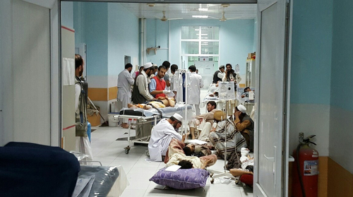 In this image taken 01 October 2015 staff and doctors in the MSF Trauma Centre in Kunduz, Afghanistan, treat people wounded in fighting that has broken out in the town. NOTE: This image was taken two days before the hospital came under aerieal attack killing staff members and patients and partially destroying the facility. "Since Monday morning, weÕve received 296 wounded patients, including 64 children. Seventy-four of our patients arrived in a critical condition. Most have gunshot wounds from being caught in the crossfire. Our surgeons have been treating very severe abdominal wounds and limb and head injuries. " said Dr Masood Nasim, 01 Oct 2015. "The hospital has been completely full of patients. We normally have a capacity of 92 beds, but we expanded immediately and increased theÊnumber of beds to 150. There have been patients in the offices, in the examination rooms, and being stabilised on mattresses on the floor."