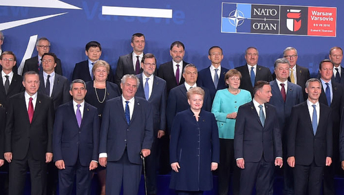 Family photo of Allied and Partner Heads of State and Government and Head of International Organizations - NATO Summit Warsaw